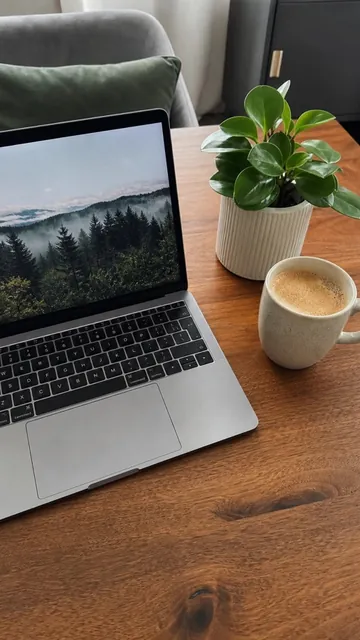 His answer: coffee beside a laptop and a plant, with his selfie in the corner.